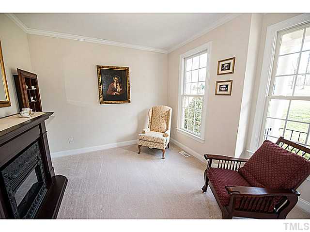 208 Okamato Street Raleigh, NC 27603 - Photo 5 of 25 Formal living room with crown molding.