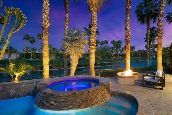 a view of swimming pool with outdoor seating