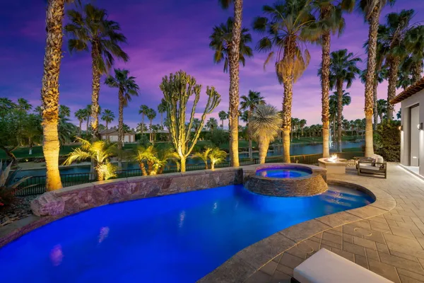 a view of a lobby with a couch and potted plants