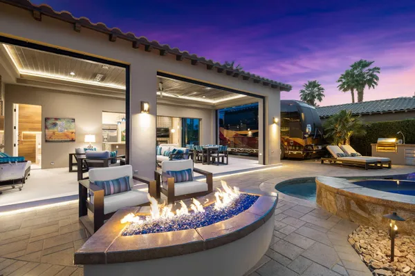 a living room with furniture and a swimming pool