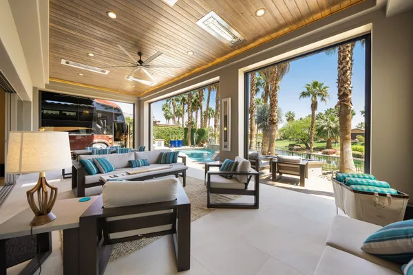 a view of a dining room with furniture window and outside view