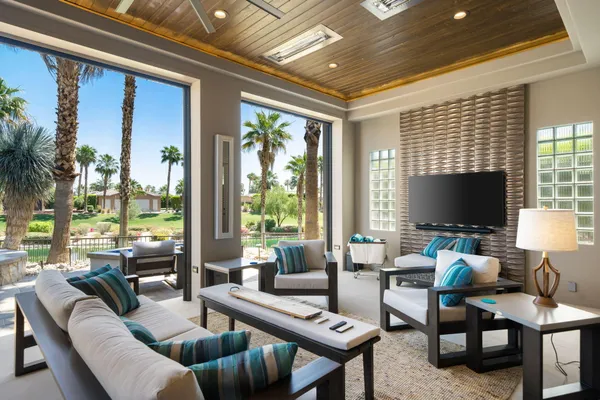a view of a patio with couches table and chairs