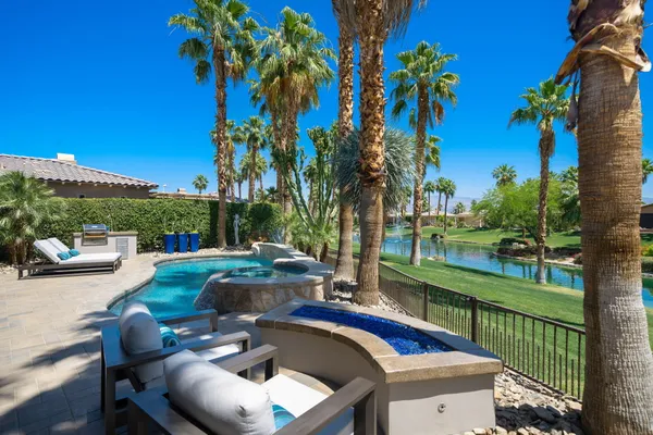 a view of a swimming pool with a patio