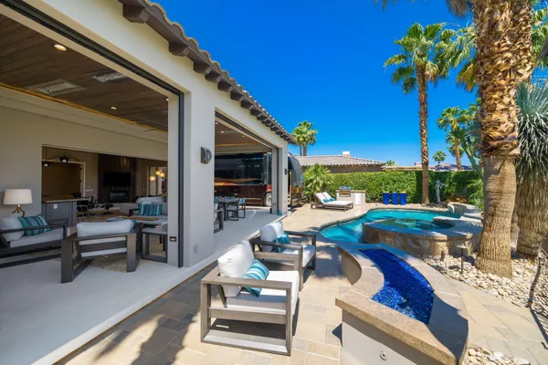 a view of a swimming pool with a patio