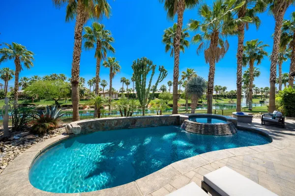 a view of a swimming pool with a patio
