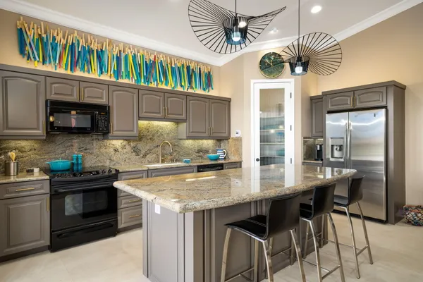 a very nice looking living room with a large window and a flat screen tv