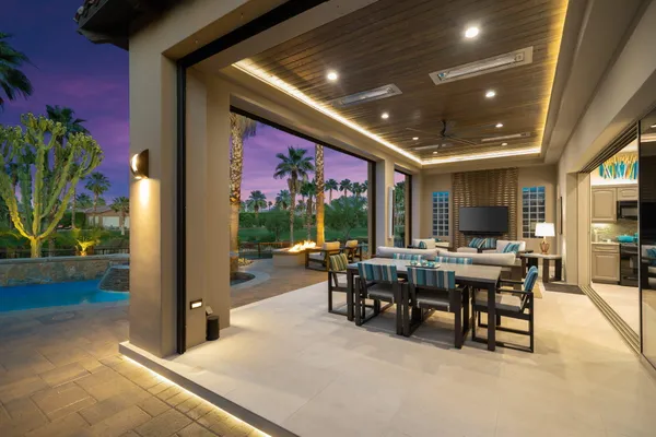 a view of a dining room with furniture window and outdoor kitchen