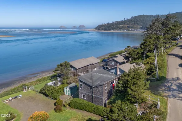 an aerial view of a house with a lake view