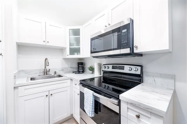 a kitchen with a stove and a microwave