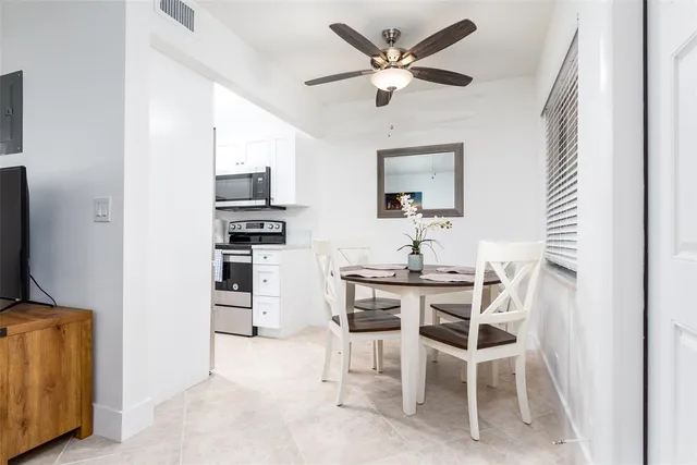 a view of a workspace with furniture