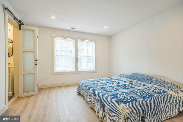 a bedroom with a bed and a walk in closet