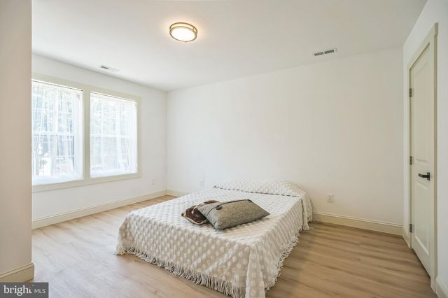 a bedroom with a bed and a cabinets