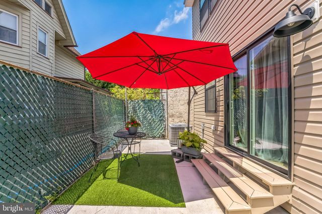 an aerial view of residential houses with city view