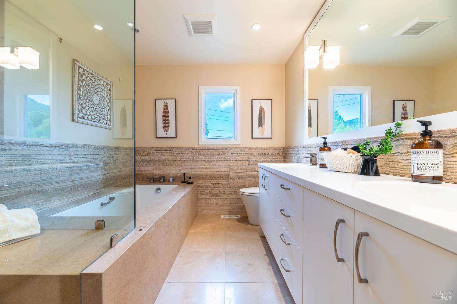4 Galway Lane San Rafael, CA 94903 - Photo 22 of 45 a spacious bathroom with a double vanity sink a mirror and a bathtub
