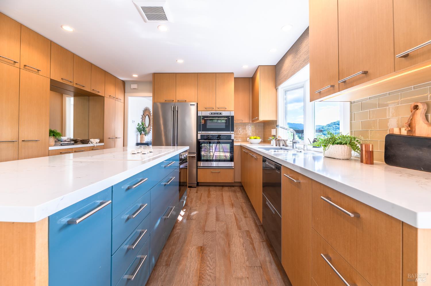 4 Galway Lane San Rafael, CA 94903 - Photo 4 of 45 a large kitchen with stainless steel appliances a large counter top a stove a sink a refrigerator and a microwave