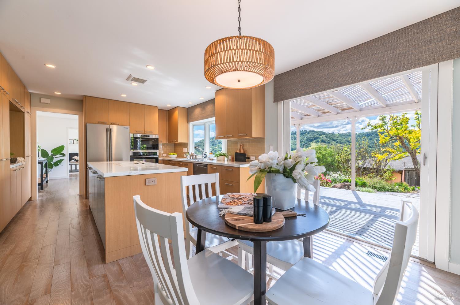 4 Galway Lane San Rafael, CA 94903 - Photo 7 of 45 a view of a dining room with furniture a chandelier and wooden floor