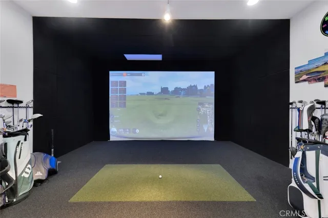 a view of a projector room with furniture and screen projector