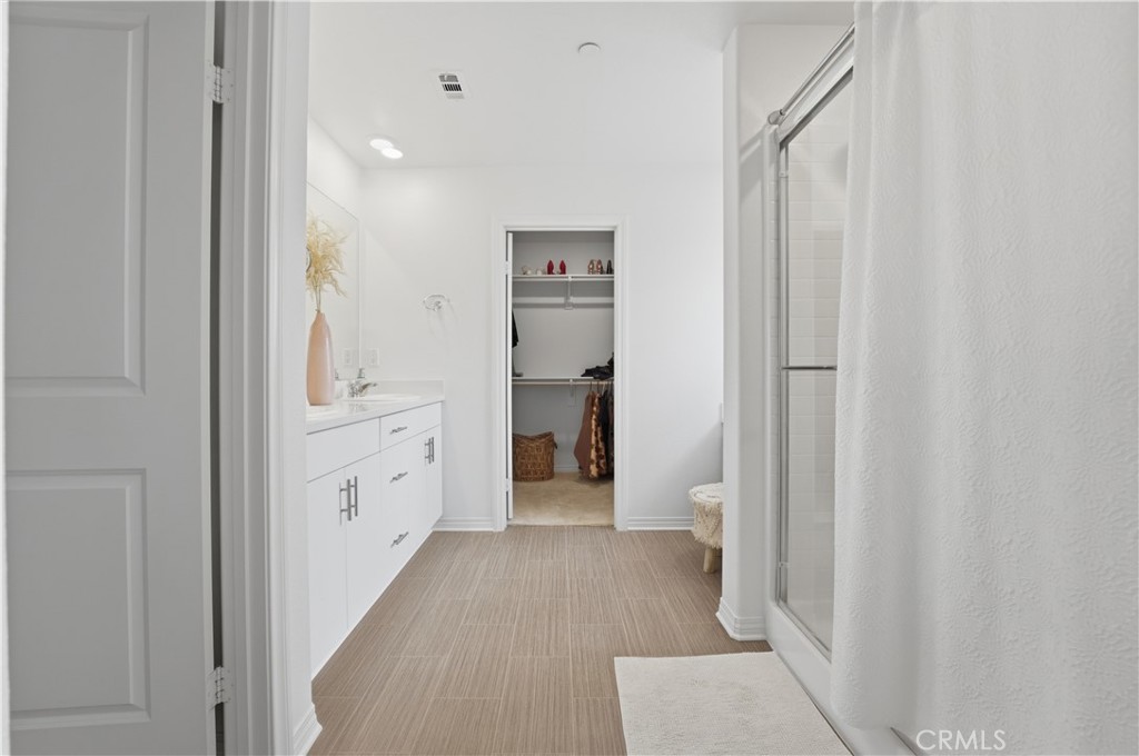 2522 Gunner Ridge Way Rialto, CA 92377 - Photo 18 of 28 a view of a hallway with wooden floor and closet area