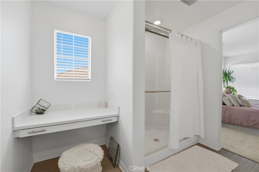 2522 Gunner Ridge Way Rialto, CA 92377 - Photo 20 of 28 a bathroom with a sink toilet and shower