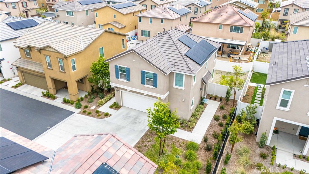 2522 Gunner Ridge Way Rialto, CA 92377 - Photo 3 of 28 a view of residential houses with yard and furniture
