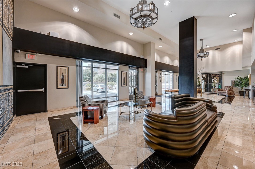 360 East Desert Inn Road, Unit 1404 Las Vegas, NV 89109 - Photo 3 of 52 Common area featuring recessed lighting and a high ceiling