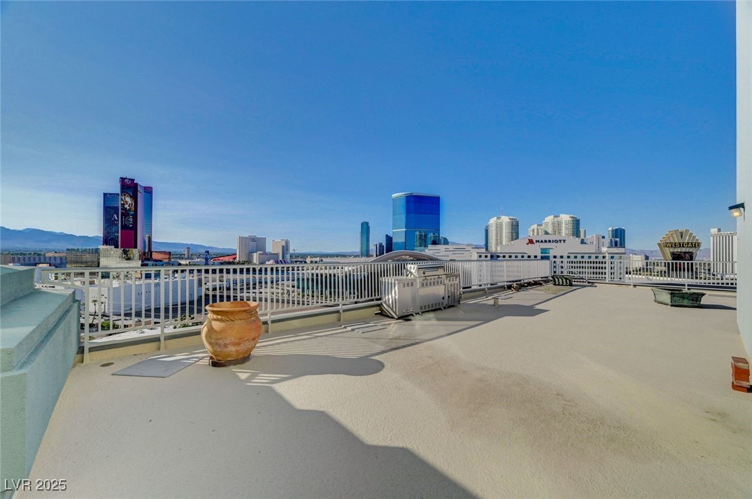 360 East Desert Inn Road, Unit 1404 Las Vegas, NV 89109 - Photo 41 of 52 View of patio / terrace with a view of skyline