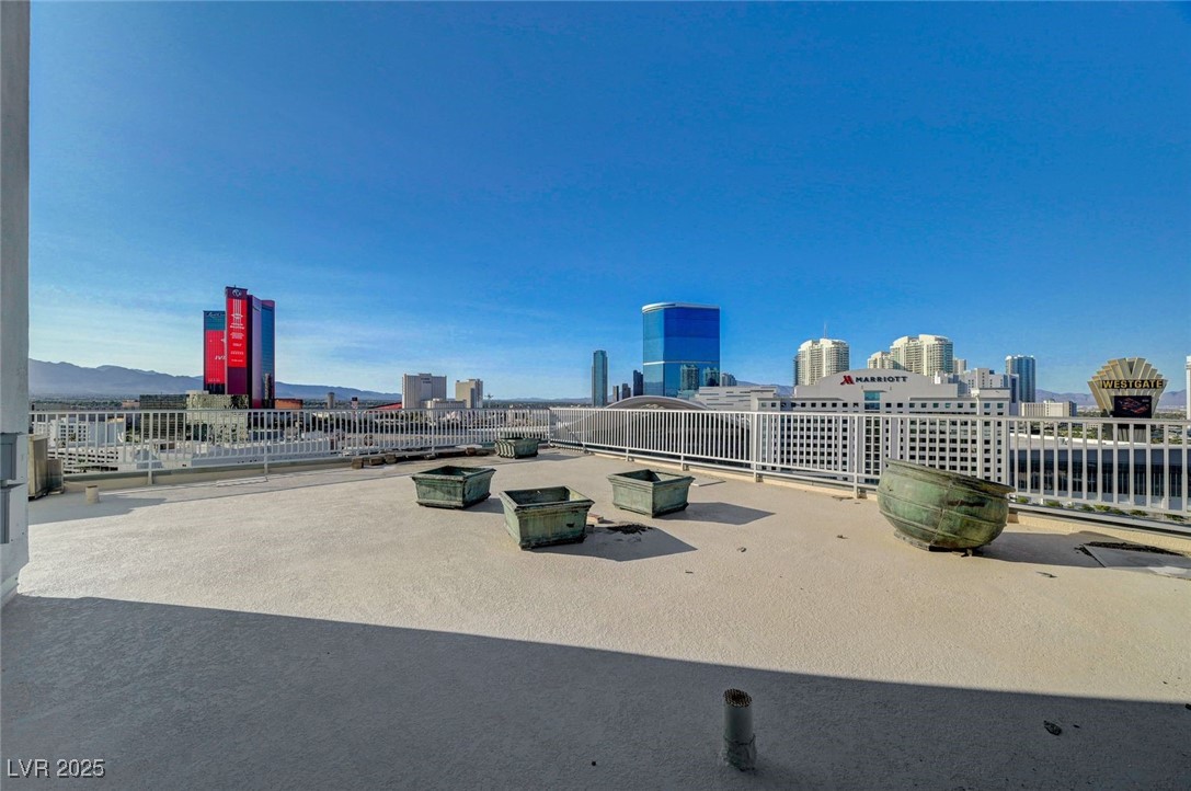360 East Desert Inn Road, Unit 1404 Las Vegas, NV 89109 - Photo 42 of 52 View of patio / terrace featuring a view of skyline