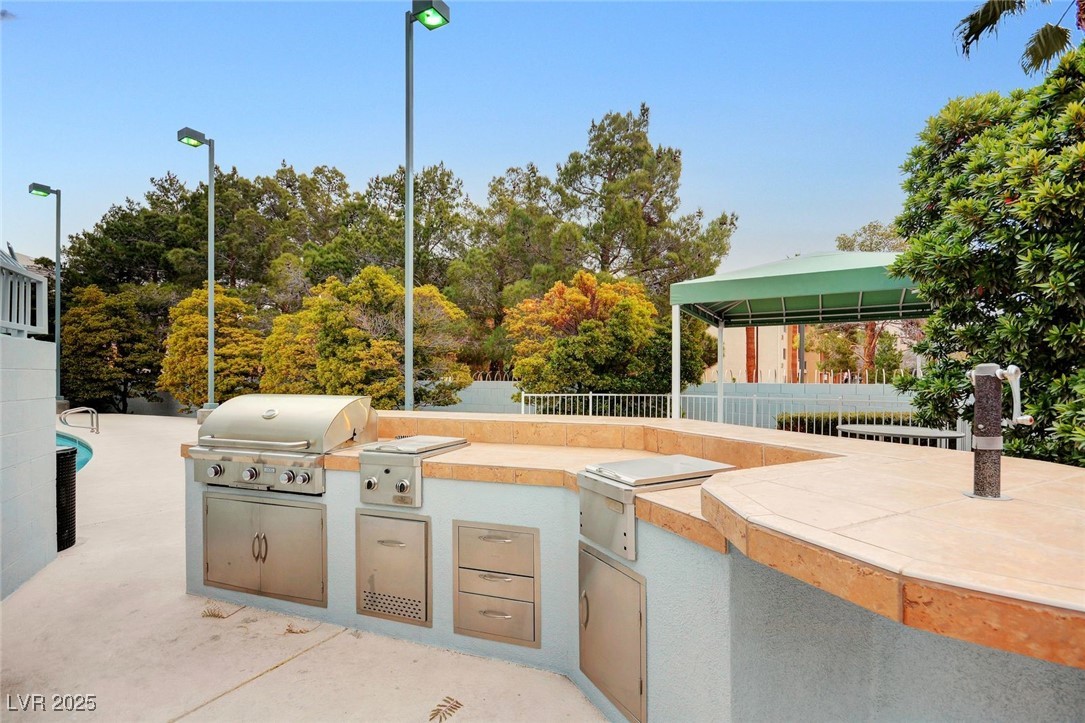 360 East Desert Inn Road, Unit 1404 Las Vegas, NV 89109 - Photo 45 of 52 View of patio / terrace with area for grilling