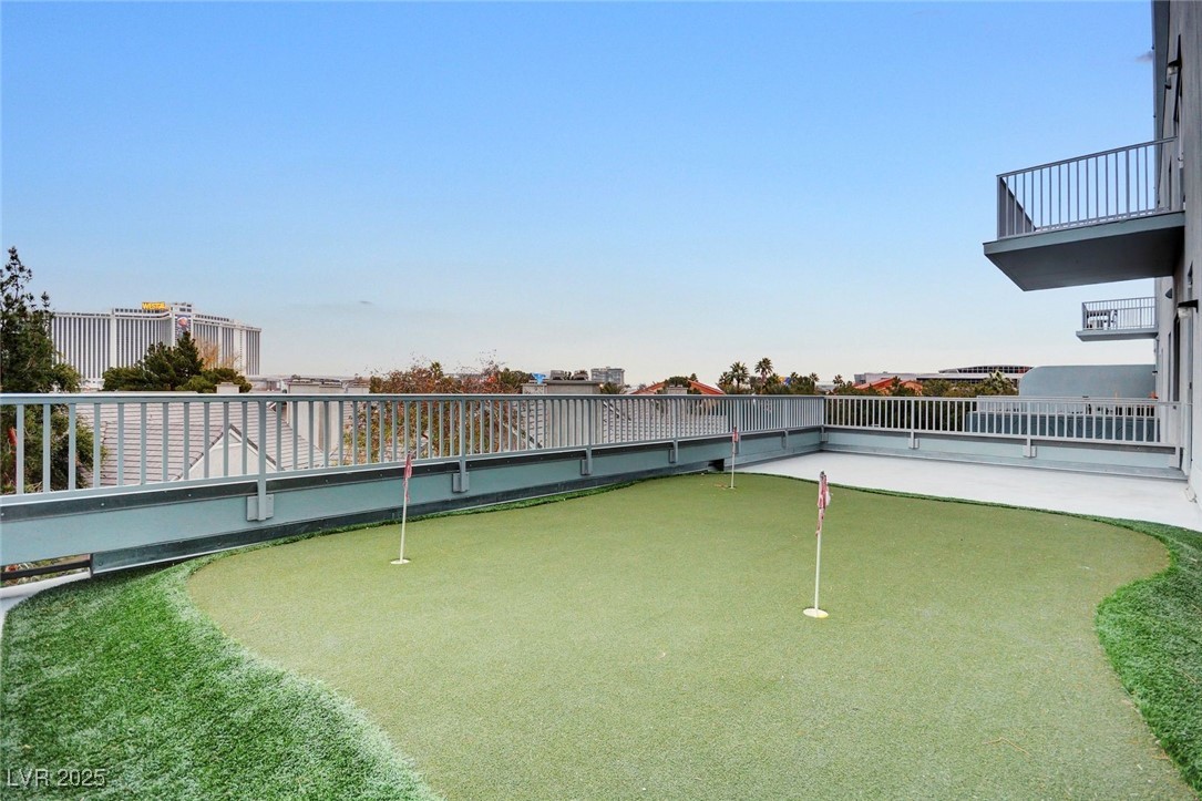360 East Desert Inn Road, Unit 1404 Las Vegas, NV 89109 - Photo 47 of 52 View of community featuring a putting green and a patio area