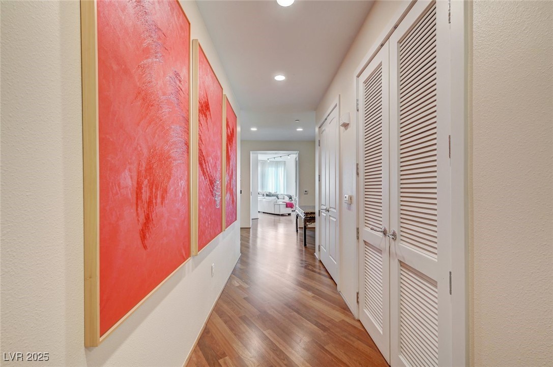 360 East Desert Inn Road, Unit 1404 Las Vegas, NV 89109 - Photo 7 of 52 Hall with wood finished floors, recessed lighting, and a textured wall