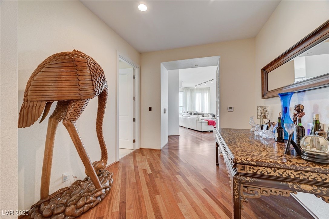 360 East Desert Inn Road, Unit 1404 Las Vegas, NV 89109 - Photo 8 of 52 Hallway featuring light wood finished floors