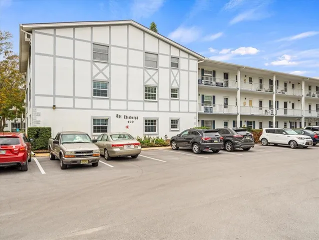 a view of a cars parked in front of a building