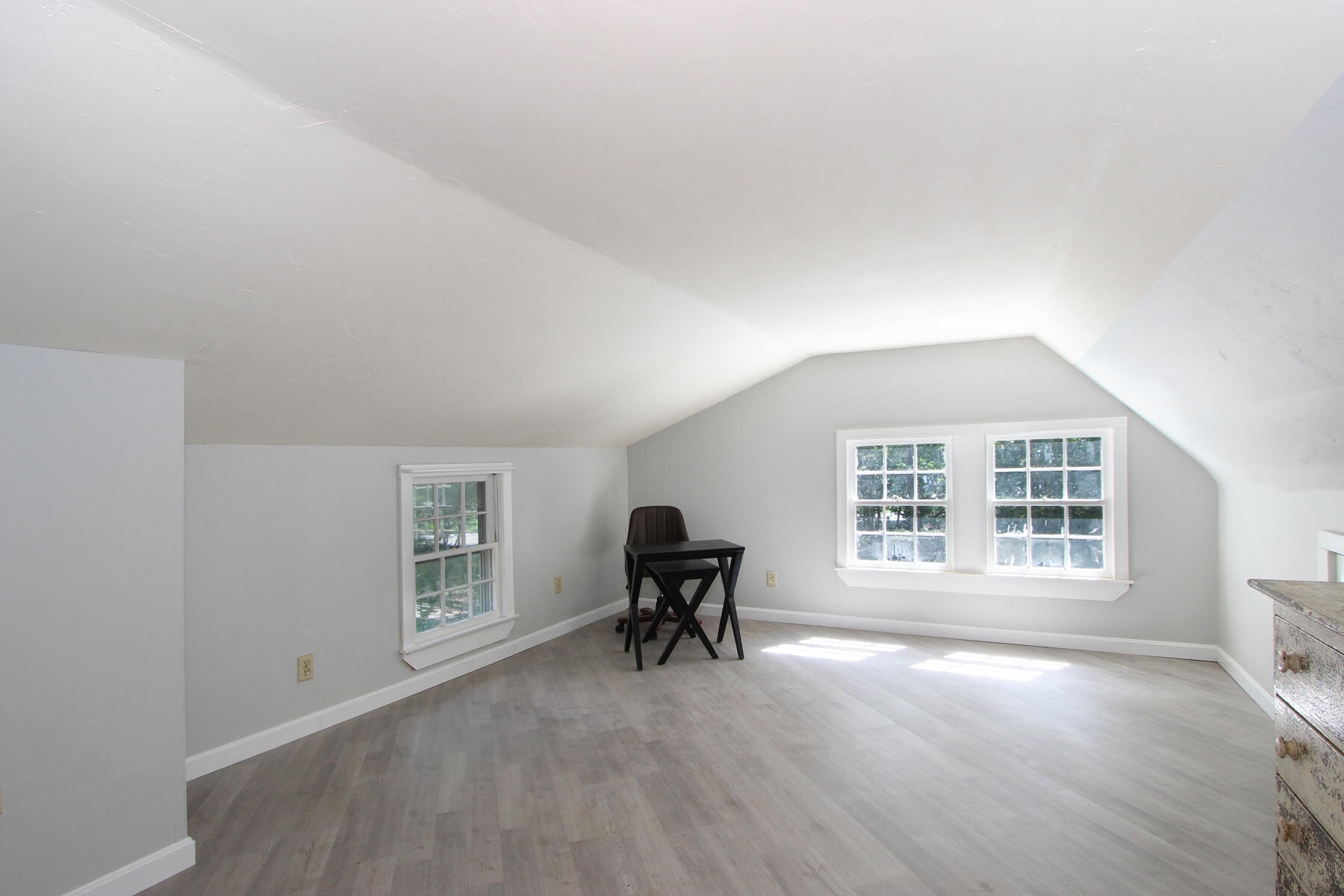 184 Sisson Road Harwich, MA 02645 - Photo 15 of 22 a view of an empty room with a window and wooden floor