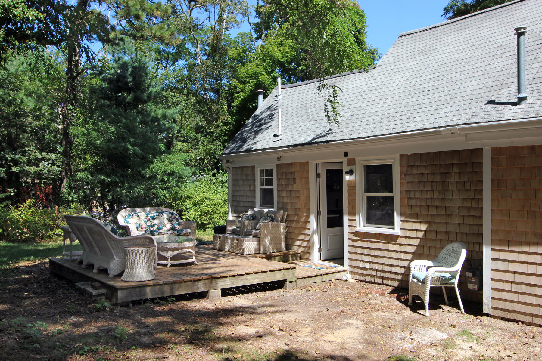 184 Sisson Road Harwich, MA 02645 - Photo 20 of 22 a view of a house with backyard and sitting area