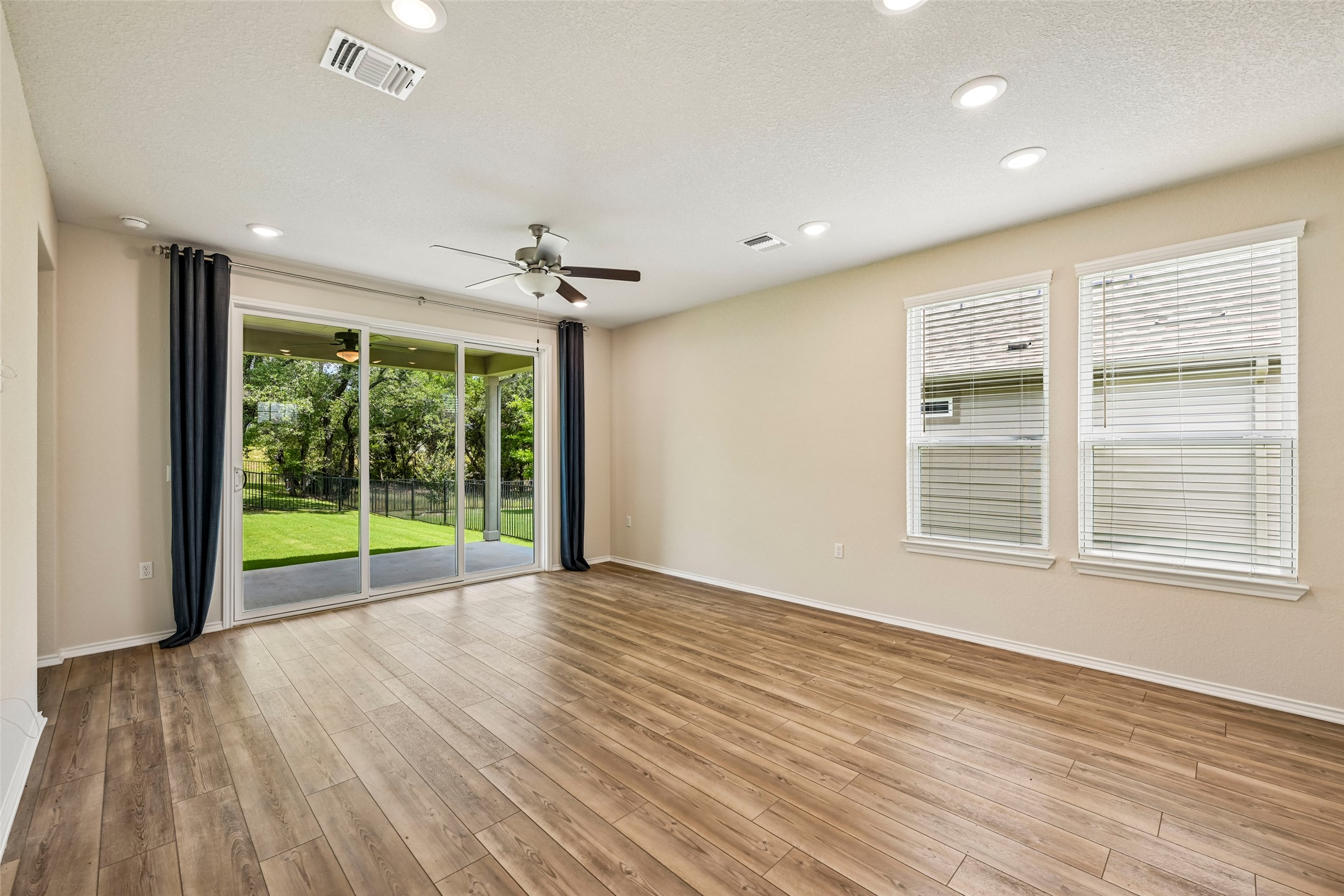 401 Yorktown Street Georgetown, TX 78633 - Photo 16 of 38 Spacious room featuring wood-finish flooring, recessed lighting, and a ceiling fan