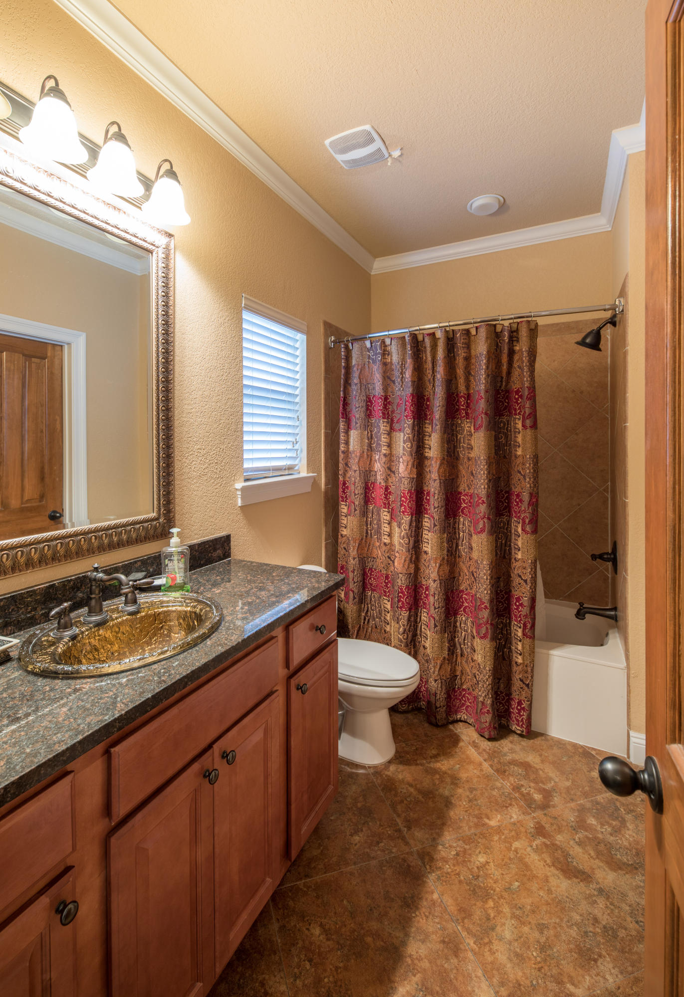 4554 Biscayne Way Destin, FL 32541 - Photo 18 of 24 a bathroom with a granite countertop sink toilet and shower