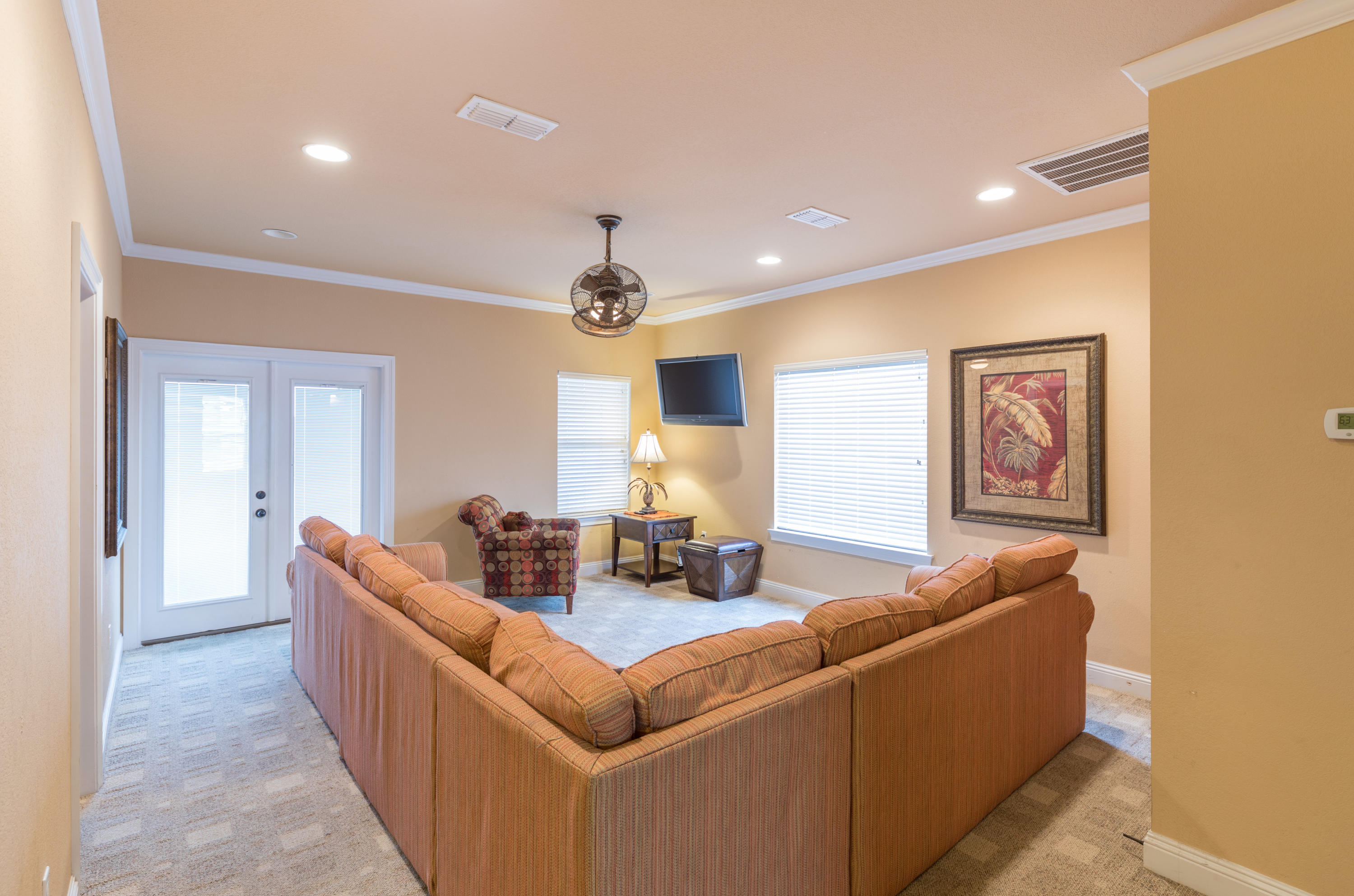 4554 Biscayne Way Destin, FL 32541 - Photo 19 of 24 a living room with furniture and a large mirror