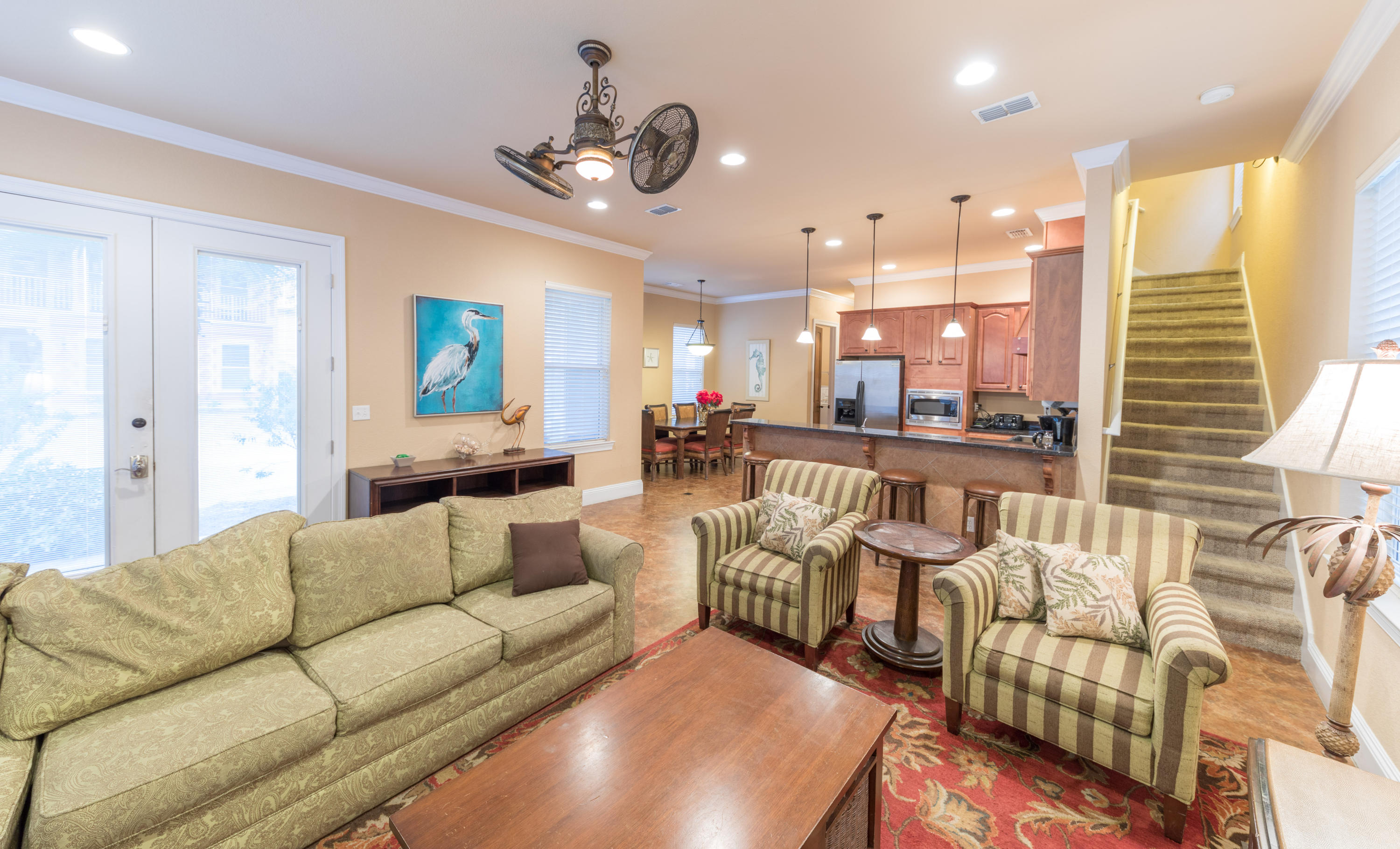4554 Biscayne Way Destin, FL 32541 - Photo 7 of 24 a living room with furniture kitchen view and a large window