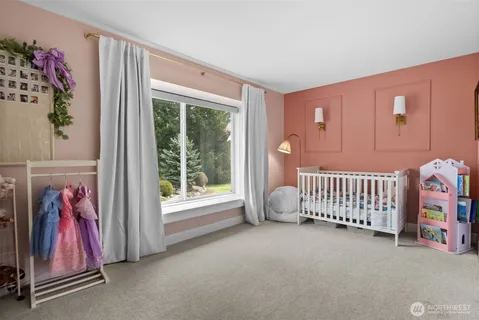 a bathroom with a granite countertop sink a large mirror and shower
