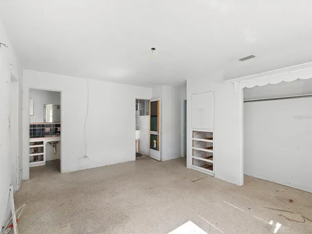 a bathroom with a sink a toilet and shower curtain