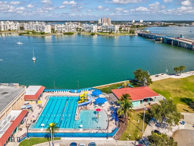 an aerial view of a house with a lake view
