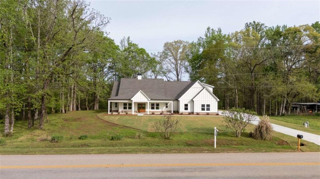 11691 Hazelbrand Road Northeast Covington, GA 30014 - Photo 45 of 53 a view of a house with a yard