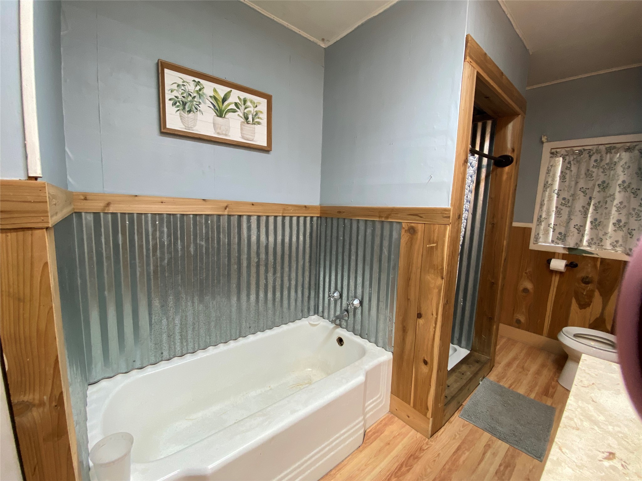 6814 Church Street Wallis, TX 77485 - Photo 14 of 29 a bathroom with a bathtub and a shower
