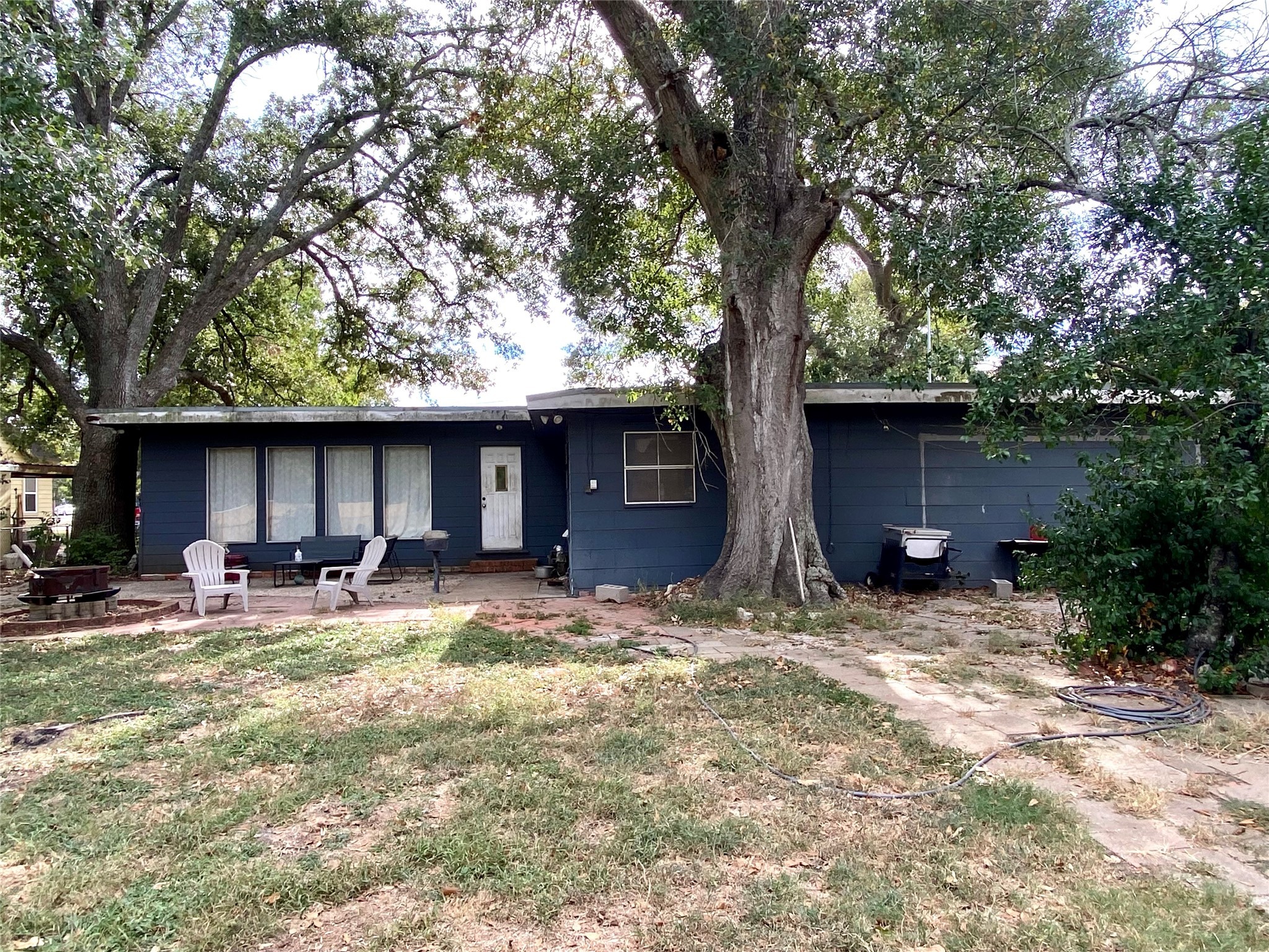 6814 Church Street Wallis, TX 77485 - Photo 26 of 29 a backyard of a house with yard fire pit and outdoor seating