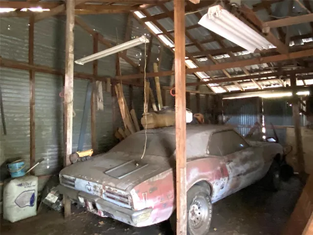 a outdoor space with lots of car parked