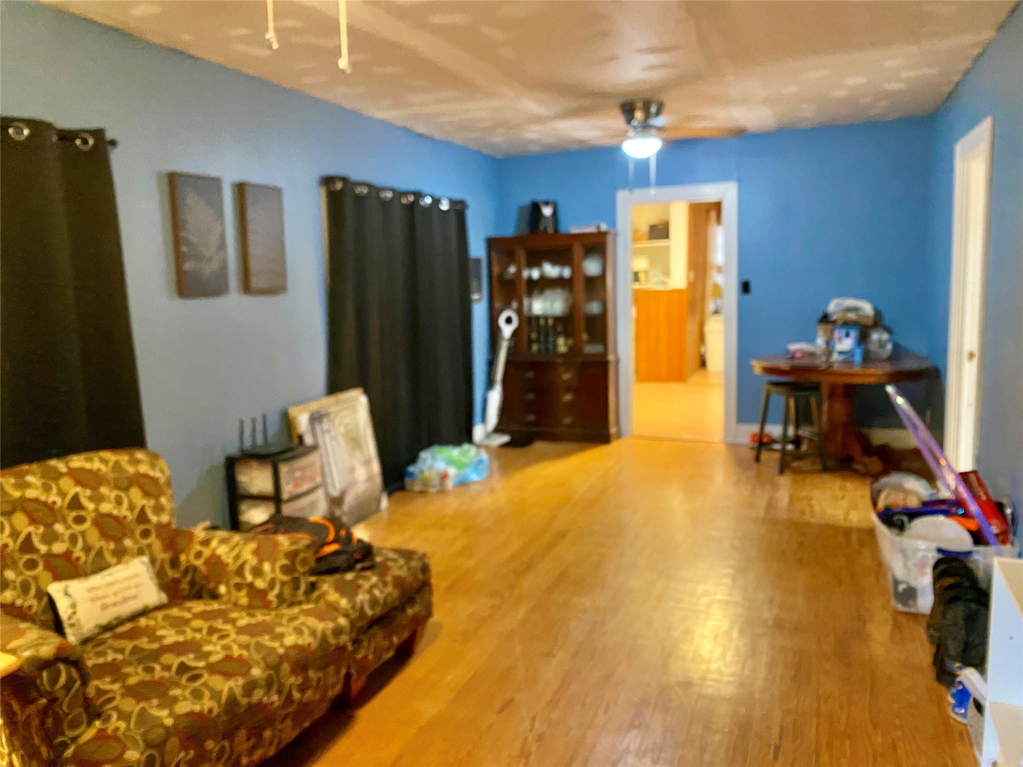 6814 Church Street Wallis, TX 77485 - Photo 3 of 29 a bedroom with a bed and wooden floor