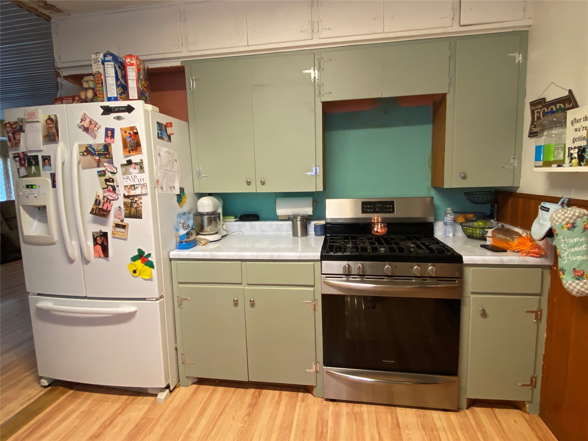 6814 Church Street Wallis, TX 77485 - Photo 4 of 29 a kitchen with a refrigerator and a stove top oven