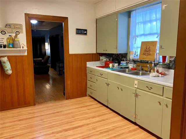 a kitchen with a sink and cabinets