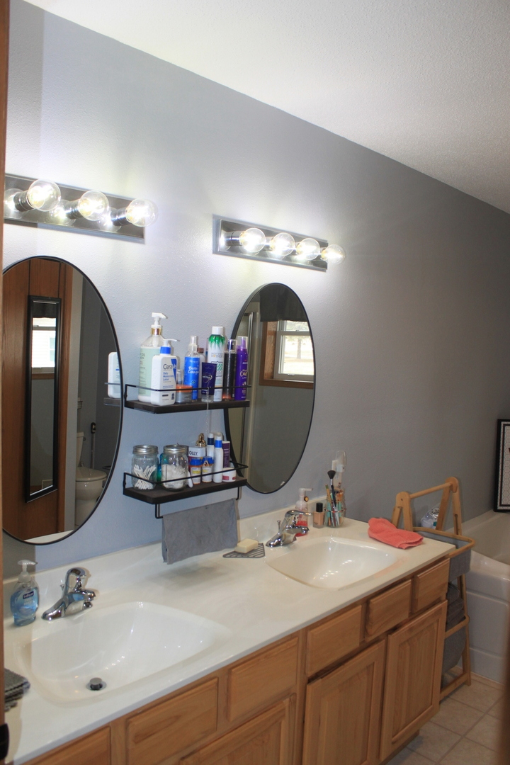 22862 Prophet Road Rock Falls, IL 61071 - Photo 11 of 24 a bathroom with a sink and a mirror