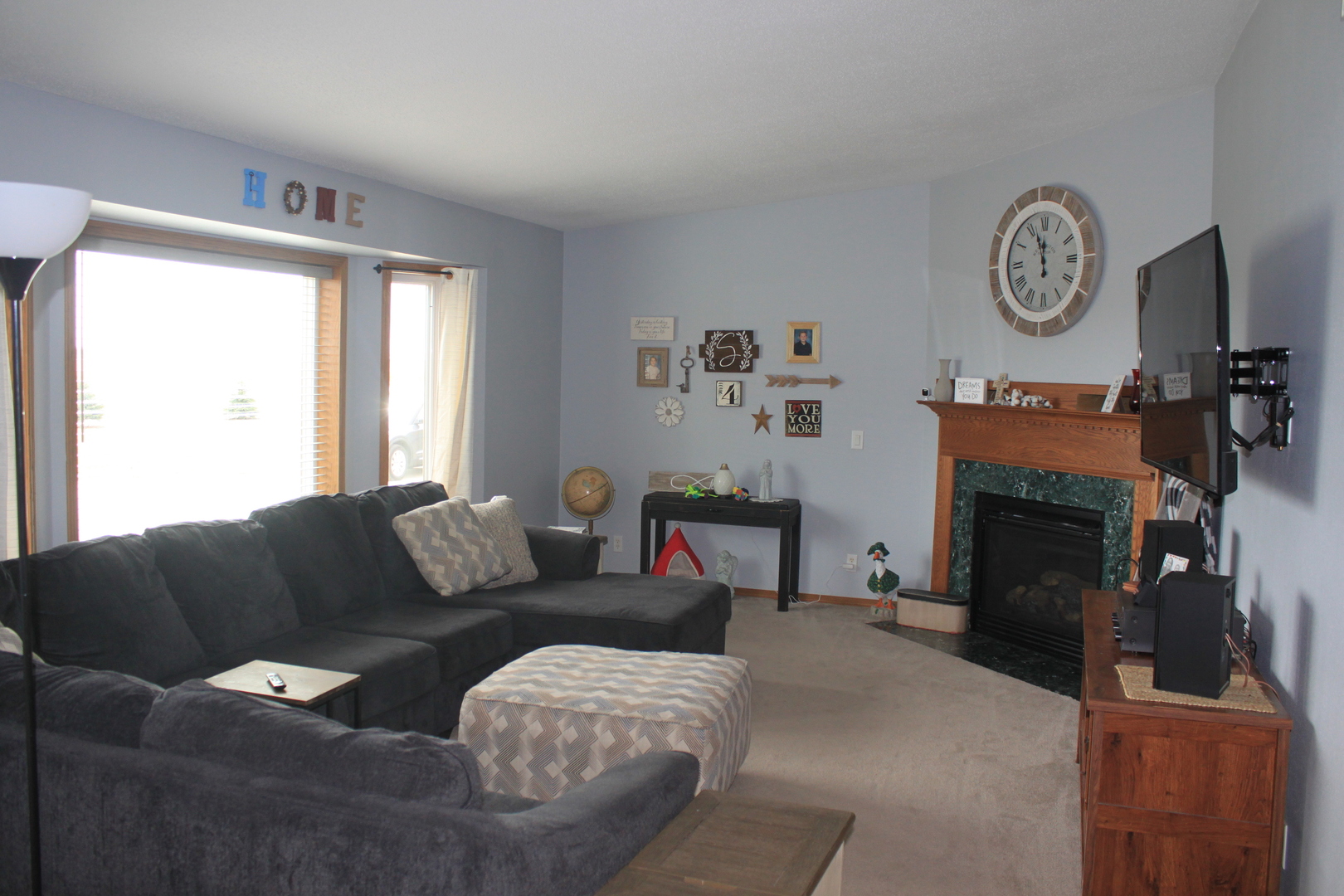 22862 Prophet Road Rock Falls, IL 61071 - Photo 2 of 24 a living room with furniture a clock and a window